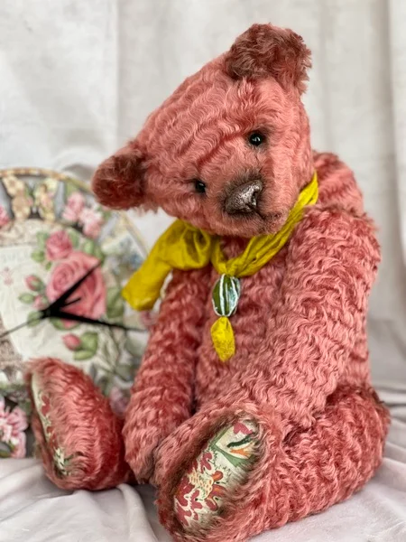 large coral teddy bear as a keepsake